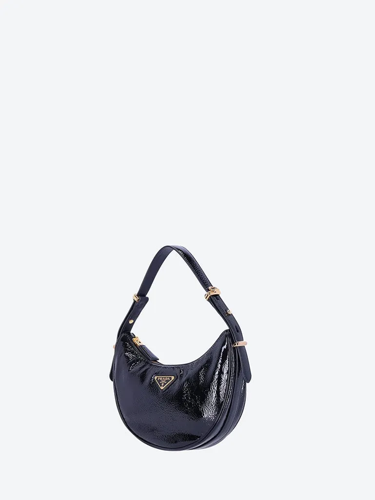 Leather arqué patent handbag